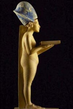 This limestone statue of Pharaoh Akhenaten holding an offering table has been taken from the Egyptian Museum.