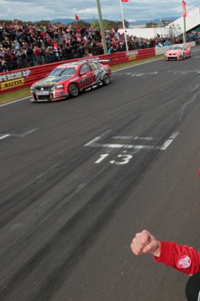 Holden heaven: Garth Tander and Nick Percat hold on to clinch the Bathurst 1000 crown.