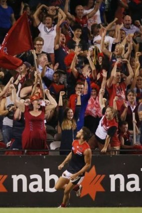 Footy needs to be fun: Jeremy Howe and Demons fans celebrate a pre-season goal.