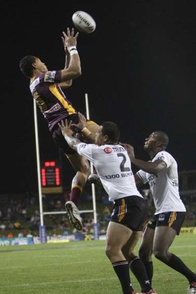Israel Folau of the Broncos secures the high ball, or takes a mark, depending on your state.