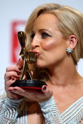 Top spot: Carrie Bickmore poses with her Gold Logie award.