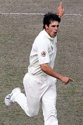 Mitch craft ... Johnson celebrates after bowling Black Caps opener Tim McIntosh yesterday. The wicket was Johnson's 150th Test scalp.