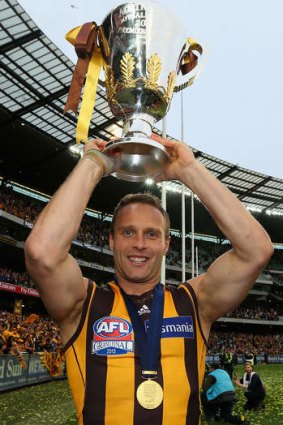Brad Sewell celebrates with the AFL Premiership Cup.