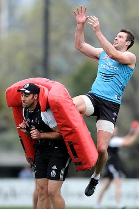 Darren Jolly trains in front of the Collingwood army yesterday.
