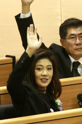 A nation divided ... Thai Prime Minister Yingluck Shinawatra, front, votes in parliament.