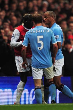 Flashpoint ... Pablo Zabaleta of Manchester City and Bacary Sagna of Arsenal clash.