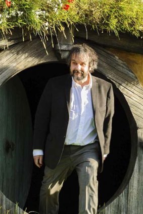 Directing magic ... Peter Jackson emerges from a 'Hobbit Hole'.