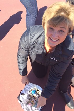 Belinda Barnier with the coins she collected for the Big Heart Project during her morning walk around Yarralumla and Braddon on Wednesday.