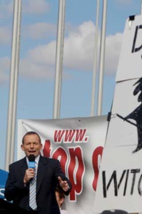 Tony Abbott distanced himself from the more offensive signs at the No Carbon Tax rally outside Parliament House.