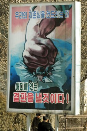 Put-down: A North Korean poster shows a fist crushing a US soldier.
