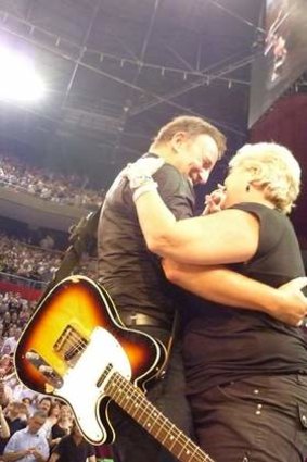 Dream come true: Kim Cowan, of Charlestown, got to dance with Bruce Springsteen.