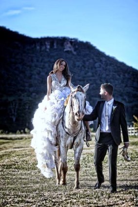 Riding high ... Kyly Boldy and Michael Clarke at their Blue Mountains wedding.