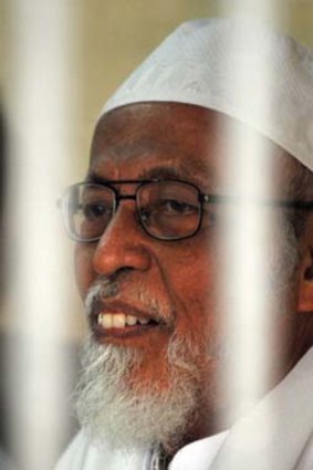 Abu Bakar Bashir waits in a holding cell at the Jakarta court yesterday.
