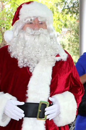 Christmas cancelled ... Kyle (as Santa) and Jackie O visiting the Sydney Children's Hospital last month.