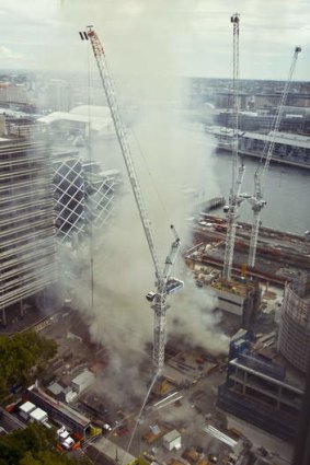 Delays: Cranes at the site of the Barangaroo fire.
