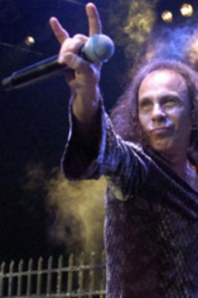 Call sign ... Ronnie James Dio makes the  "devil horns" gesture.