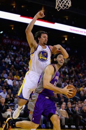 Down and out: Andrew Bogut (left) has again been sidelined.