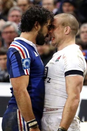 Heady affair: France's Yoann Huget confronts England's Mike Brown.