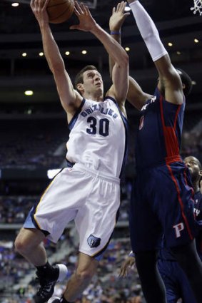 Memphis Grizzlies forward Jon Leuer goes to the basket against Detroit Pistons centre Andre Drummond.