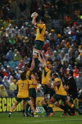 Sam Carter leaps to take the ball in a lineout during the first Bledisloe test in Sydney.