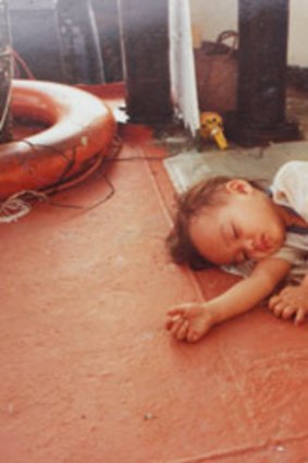 Alisha Fernando as she was found aged two in 1982 during her family's flight across the South China Sea. She is now a project manager at ANZ.