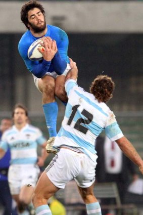 Italy's Luke McLean takes a high ball.