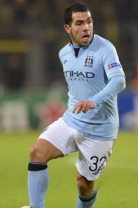 Carlos Tevez has been arrested on suspicion of driving while disqualified.