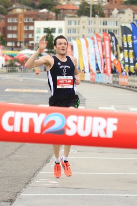 Craig Mottram crosses the line in the City2Surf. 