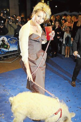 Emma Thompson arrives at the premiere of Nanny McPhee with a pig.