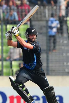 New Zealand batsman Anton Devcich hits a boundary during his knock of 59 in the T20 match against Bangladesh.