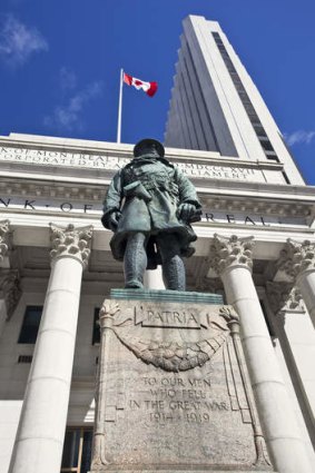 A statue of a World War I soldier at the Bank of Montreal.