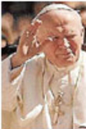 John Paul II, left, and Pius XII