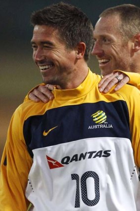 Australia's Harry Kewell (L) and Craig Moore smile during a practice session at Ruimsig stadium in Roodepoort.