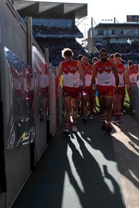 Swansong? Sydney players trudge off Simonds Stadium after their 34-point loss to Geelong.