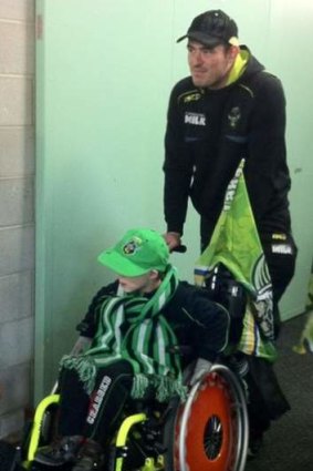 Raiders captain Terry Campese with Queanbeyan boy Bailey Whitton.