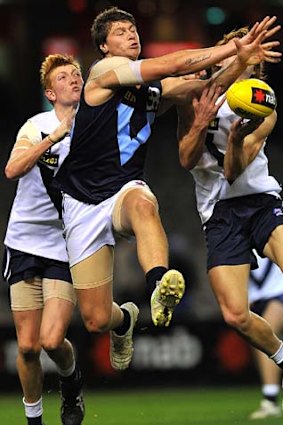 Arms out: Jonathon Patton battles for possession.