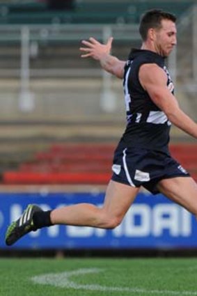 Brock McLean kicks upfield during the match against the Frankston Dolphins on Saturday.