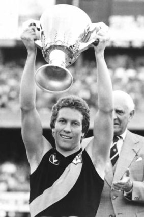 Bruce Monteath holding up the 1980 premiership cup.