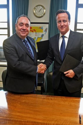 Scotland's First Minister Alex Salmond (left) and British Prime Minister David Cameron shake hands after signing an agreement to hold a referendum on Scottish independence at St Andrew's House in Edinburgh, Scotland.