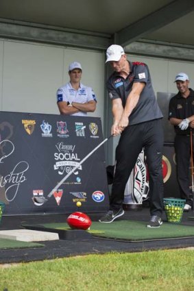 Seeing it like a footy: Brendon Goddard tees off on Monday.