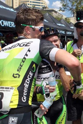 Simon Gerrans is congratulated by teammates after winning the overall classification after stage six.