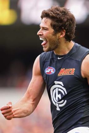 Levi Casboult celebrates after kicking a goal against the Bombers.