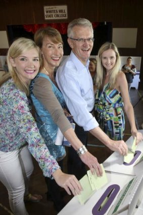 Candidate for Griffith in Brisbane Bill Glasson with daughters Gemma (left)  and wife Claire and daughter Nicola at Whites Hill  State College Polling Station