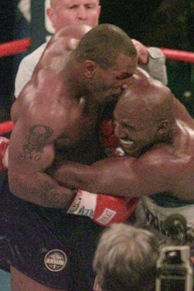 Crunch ... Mike Tyson bites into the ear of Evander Holyfield in their WBA Heavyweight match.