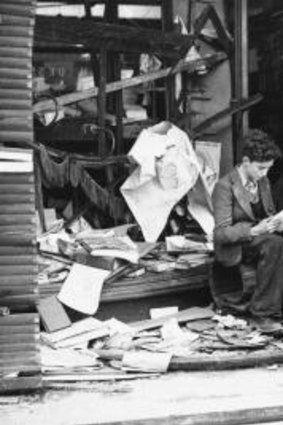 Literature: A boy  amid the ruins of a London bookshop following an air raid on London in WW II.