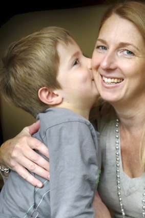 Justine May with son Kalan says she has recovered well from radical keyhole surgery to remove a kidney.