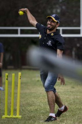 Fawad Ahmed at a cricket clinic for asylum seekers.