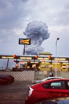 In this Instagram photo provided by Andy Bartee, a plume of smoke can be seen rising from the Texas fertiliser plant.