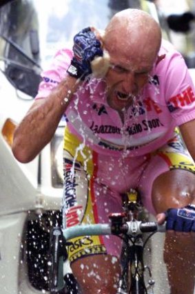 Italy's Marco Pantani cools off on his way to winning the 19th stage of the Tour of Italy, 1999.