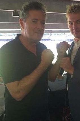 Put 'em up: Piers Morgan and Brett Lee begin shadow boxing at the MCG.